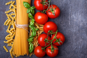 Spaghetti, tomatoes and basil, italian food background