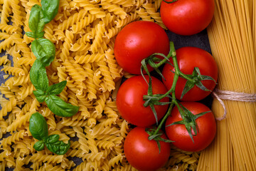 Spaghetti, tomatoes and basil, italian food background