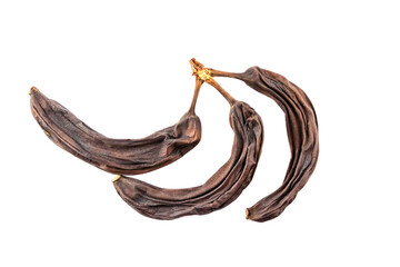 Old dried bananas, dried, isolated on a white background. Spoiled fruit