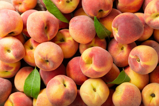 fresh peaches as background, top view