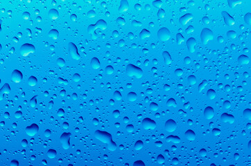 Drops of water on a blue background