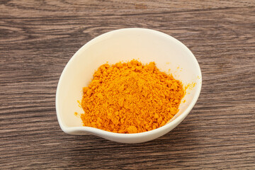 Tumeric powder in the bowl