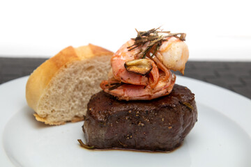 surf and turf, beef fillet with prawns and baguette