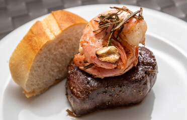 surf and turf, beef fillet with prawns and baguette
