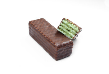 Chocolate covered wafers isolated on white background. Green Pistachio flavor food