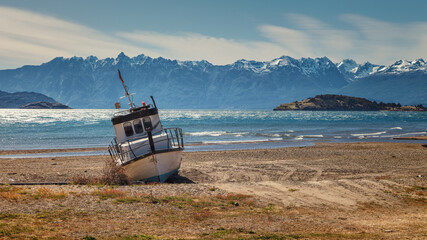 Fototapeta na wymiar boat aground on the beach of the General Carrera lake, Chilean Patagonia
