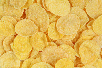 Yellow cornflakes close-up. Full frame of healthy breakfast food