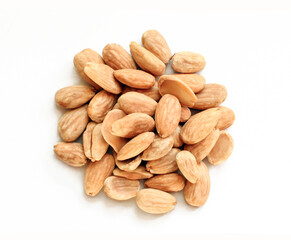 Pile of blanched almonds isolated on white background. Delicious diet food
