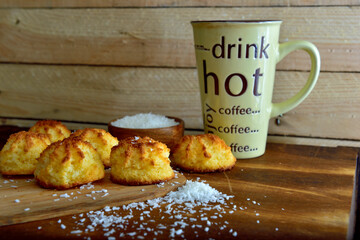 Fresh homemade coconut macaroons with a wooden background