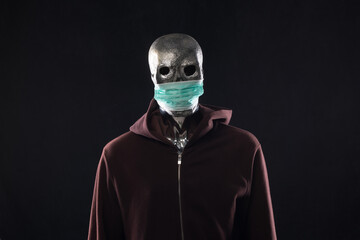 monster in a medical mask in a hood