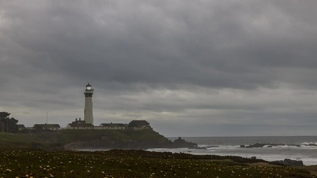 Clouds fog and wind rolls over Pigeon Point Lighthouse on this gloomy day in a time-lapse