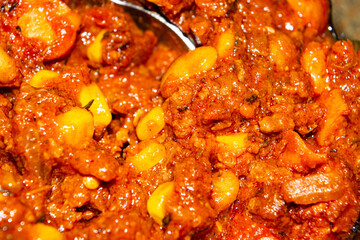 Quesadilla filling with ground beef, sausage, red beans, sweet corn, onion and tomato sauce. A traditional Mexican dish. Close up.