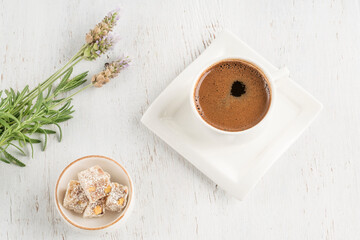 coffee and Turkish delights on a wooden table with copy space