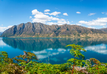 Reflections on Beautiful Lake Wanaka in New Zealand Mountains