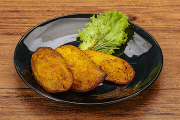 Baked potato with herbs and spices