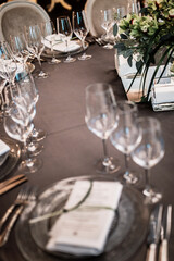 wedding table setting. glasses in blur