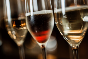 three glasses with red wine and champagne. close-up