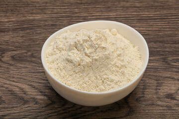 Wheat flour heap in the bowl