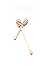 Wooden honey sticks on a white background. honey dipper