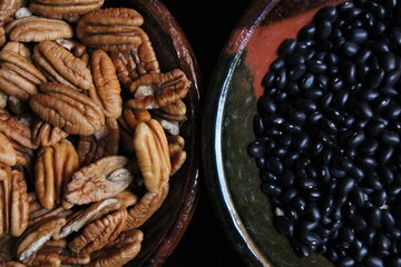Bowl with pecans and with black beans