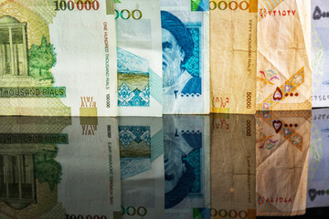 Iranian Rial (IRR). Close-up detail of banknotes.  Top view.