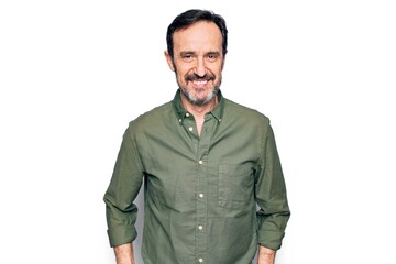 Middle age handsome man wearing casual green shirt over isolated white background with a happy and...