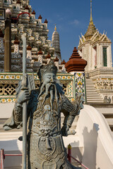 chinese worrior sculpture in Wat Arun a Buddhist temple in Bangkok
