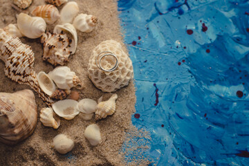 wedding on the beach wedding rings on the shell nautical composition summer background