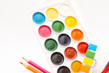 Fototapeta premium Children's Preschool Art Supplies.pencils, scissors, paints isolated on white background.Great set for kids in camp, school and kindergarten.drawing set 
