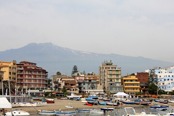 The seafront at Giardini Naxos with Mount Etna in the background