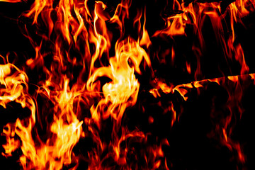 Fire on a dark background. Background from fire. Fire close up. Background for designers.Wood fire...