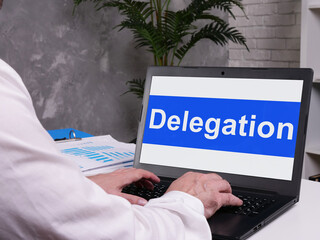 Delegation is shown on the conceptual business photo