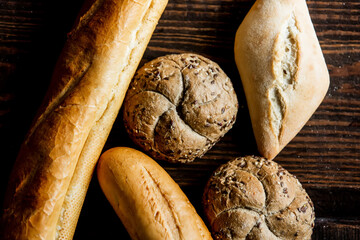 bread, bun and baguette on a table