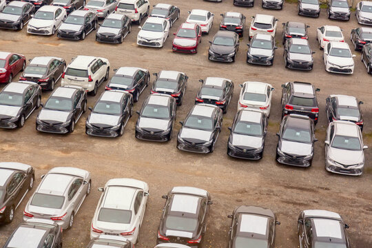 Moscow, Russia - October, 2018: Many Toyota cars on reseller parking in rows from above. Toyota is a japanese manufacturer of automobiles and commercial vehicles.