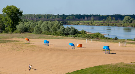 Fototapeta na wymiar empty beach by the river in eastern europe