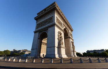 Fototapeta premium The famous Triumphal Arch at sunny day , Paris, France.