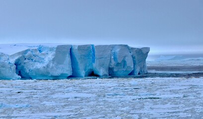 Large blue iceberg at edge of pack ice in antarctic ocean, Antarctica © HWL Photos