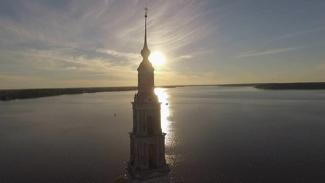 KALYAZIN, RUSSIA-15/08/2019: Fly over the water near the flooded bell tower in the middle of the Volga river in the city of Kalyazin