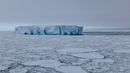 Large blue iceberg at edge of pack ice in antarctic ocean, Antarctica © HWL Photos