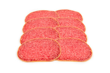 Salami slices isolated on white background.