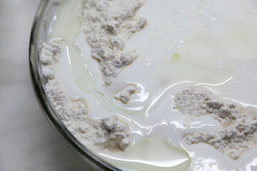 Preparation of dough from flour, butter and yogurt for baking