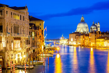 Obraz na płótnie Canvas Basilica Santa Maria della Salute, Punta della Dogona and Grand Canal at blue hour sunset in Venice, Italy with reflections.