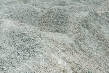 Close-up photo of white limestone surface in the deserted quarry.