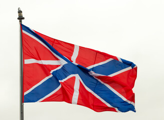 Defocused waving on wind Jack (Naval flag) and Fortress flag of Russia on cruiser Aurora