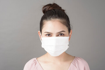 close up woman face is wearing surgical mask