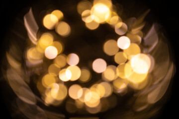 White gold abstract lights. Festive glitter blur Bokeh background. Defocused winter backdrop.