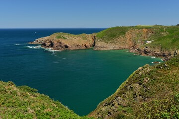 Plemont Bay, Jersey, U.K. Beautiful coastline in the Summer with a high tide.