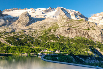 Marmolada glacier and Lago di Fedaia at sunrise, Val di Fassa valley, Dolomites, Italy - 354175568