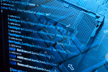 Information technology concept. Coding programmer language script text on screen monitor display with a PC keyboard and processor socket. Programmer occupation job.