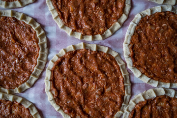 Top view of homemade pide, turkish flatbread with ground meat, mini pita breads or mini turkish pizzas